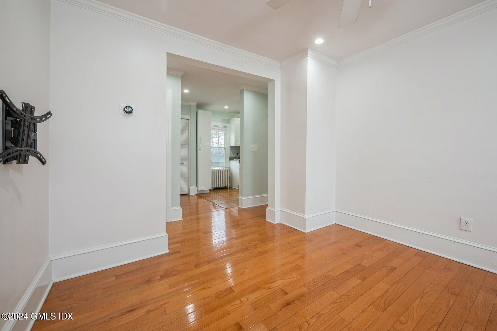 119 Halstead Avenue, Unit 2 Greenwich, CT 06831 - Photo 6 of 29 wooden floor in an empty room