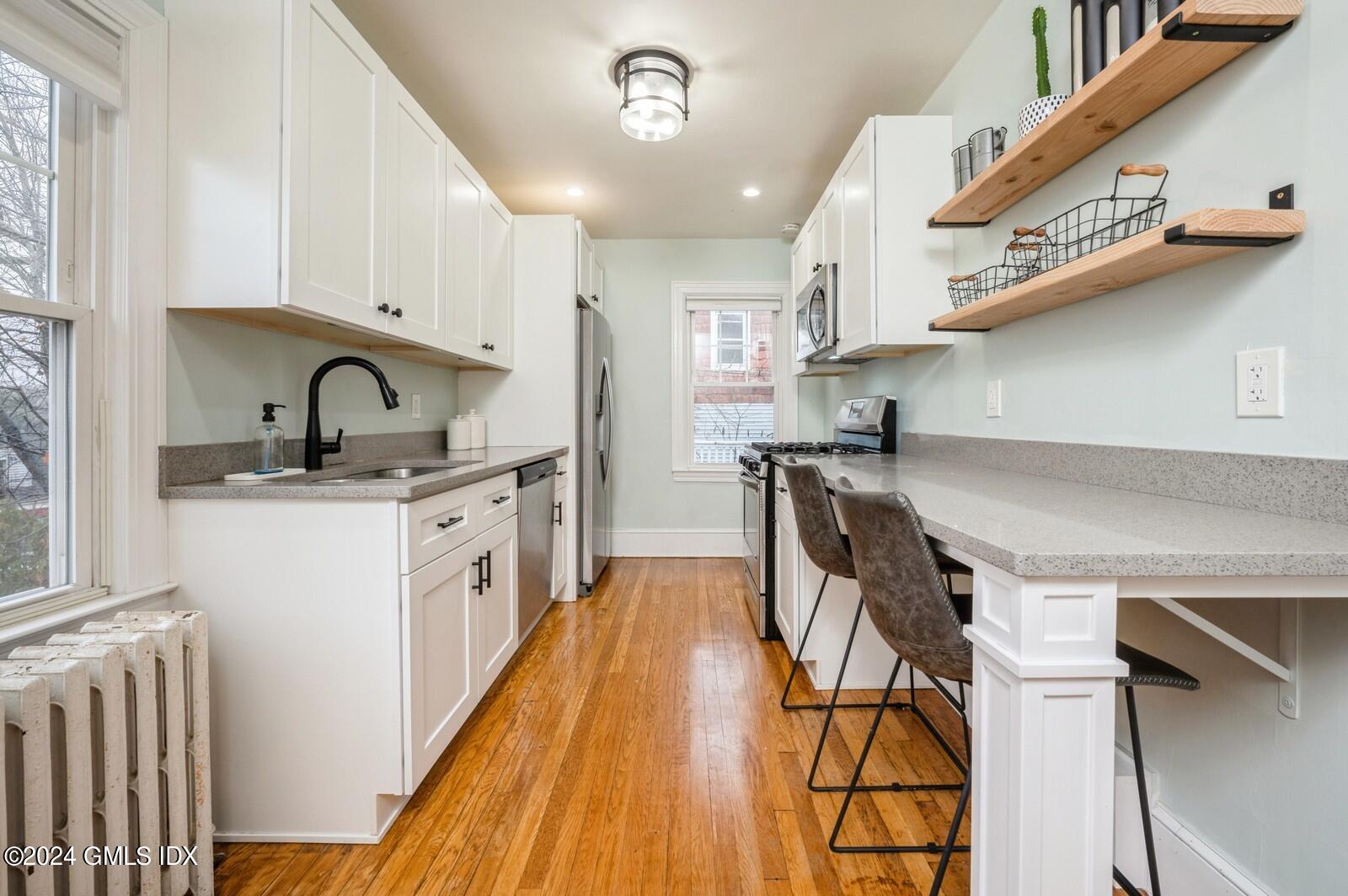 119 Halstead Avenue, Unit 2 Greenwich, CT 06831 - Photo 8 of 29 a kitchen with stainless steel appliances granite countertop a sink a stove and a refrigerator