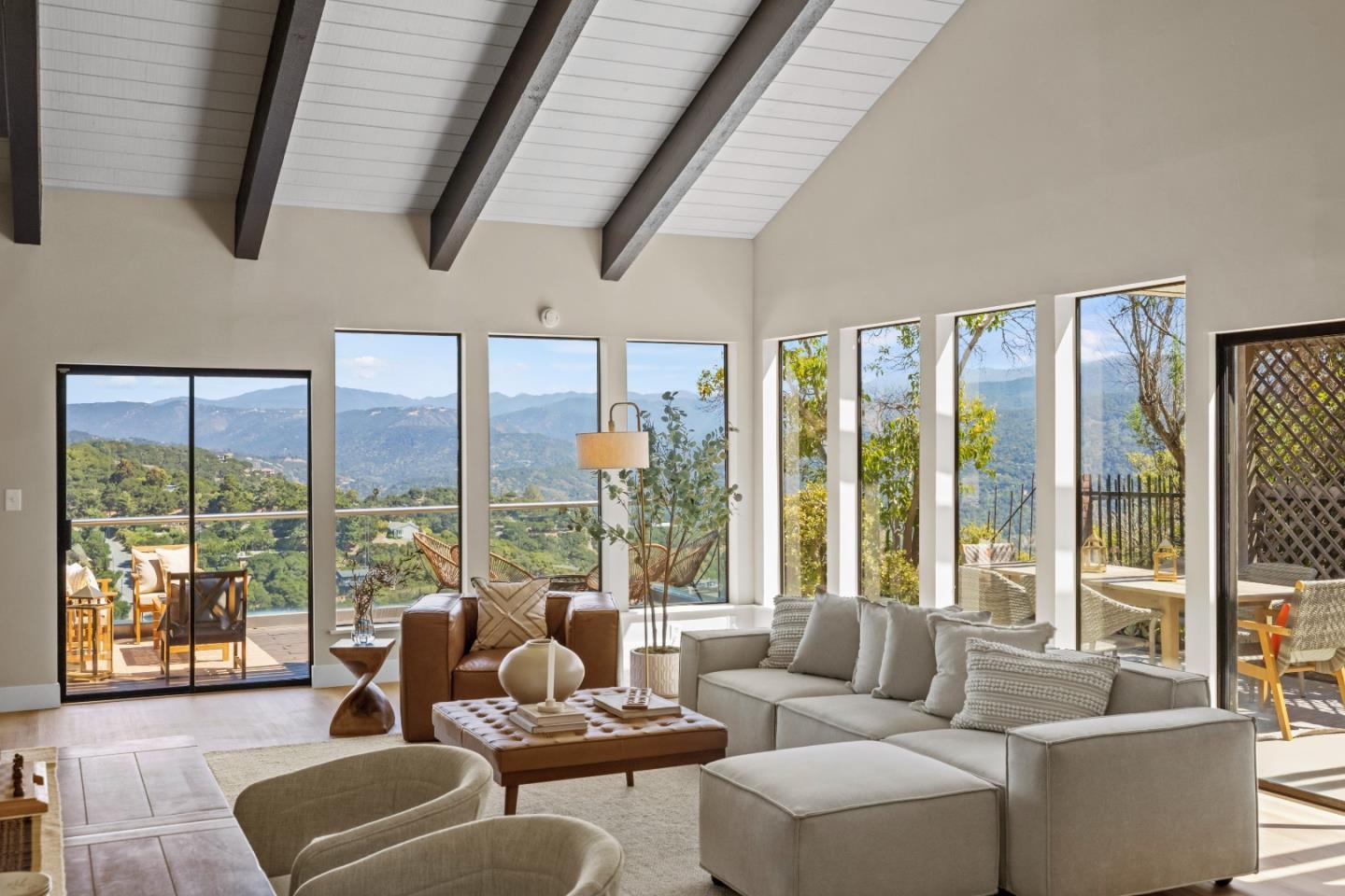 13399 Middle Canyon Road Carmel Valley, CA 93924 - Photo 11 of 32 a living room with furniture and floor to ceiling windows