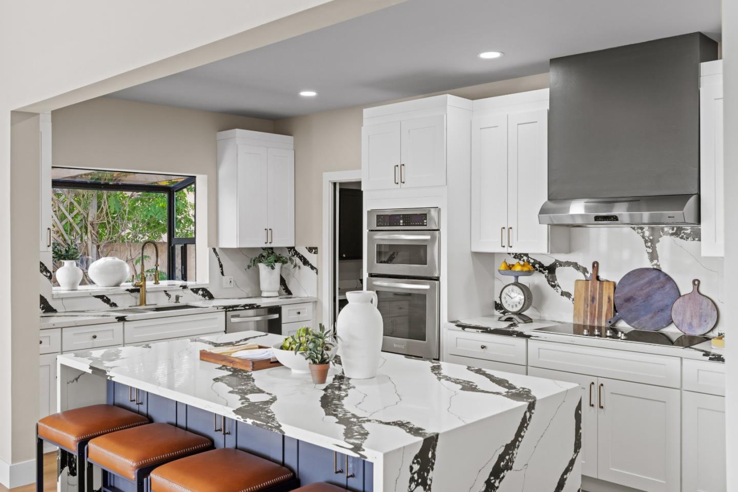 13399 Middle Canyon Road Carmel Valley, CA 93924 - Photo 13 of 32 a kitchen with stainless steel appliances kitchen island granite countertop a sink and a refrigerator