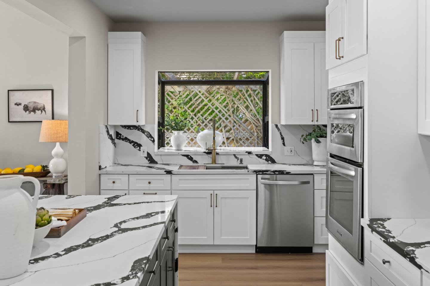 13399 Middle Canyon Road Carmel Valley, CA 93924 - Photo 14 of 32 a kitchen with a stove a sink and a refrigerator