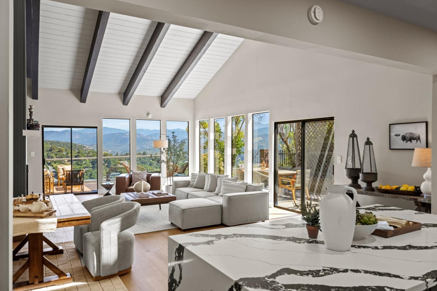 13399 Middle Canyon Road Carmel Valley, CA 93924 - Photo 15 of 32 a living room with fireplace furniture and a large window