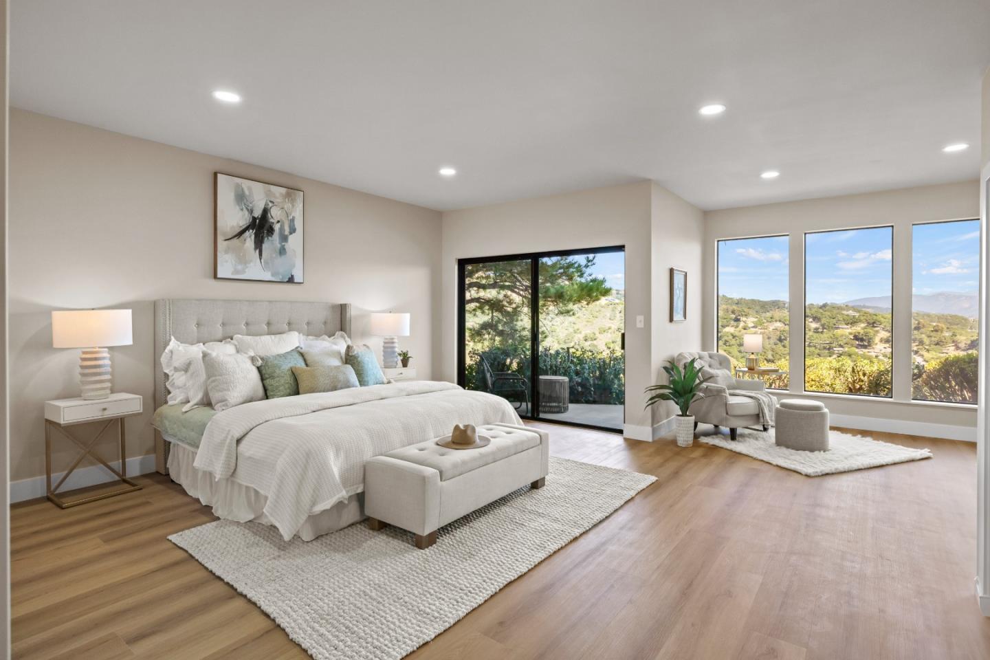 13399 Middle Canyon Road Carmel Valley, CA 93924 - Photo 16 of 32 a spacious bedroom with a large bed and a large window