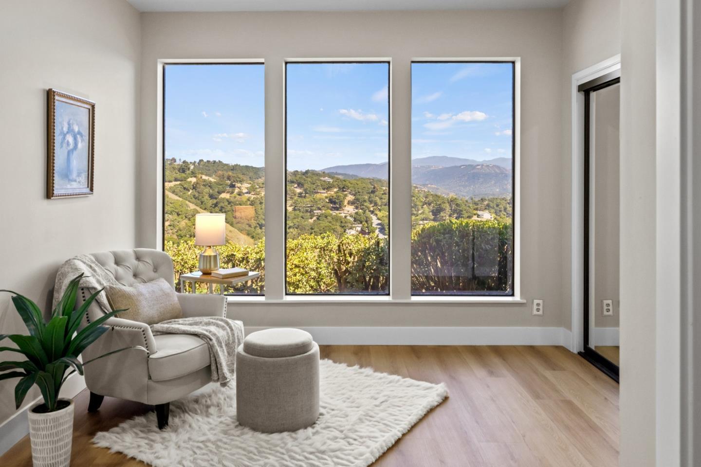 13399 Middle Canyon Road Carmel Valley, CA 93924 - Photo 17 of 32 a living room with furniture and a window