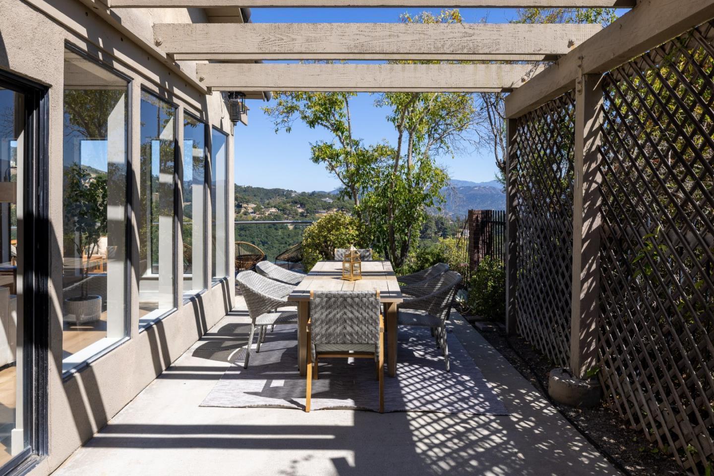 13399 Middle Canyon Road Carmel Valley, CA 93924 - Photo 25 of 32 a view of a patio with a table and chairs