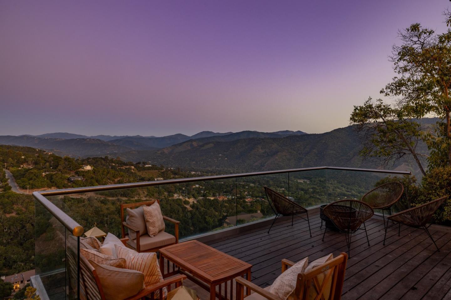 13399 Middle Canyon Road Carmel Valley, CA 93924 - Photo 27 of 32 a view of a balcony with wooden floor and a table