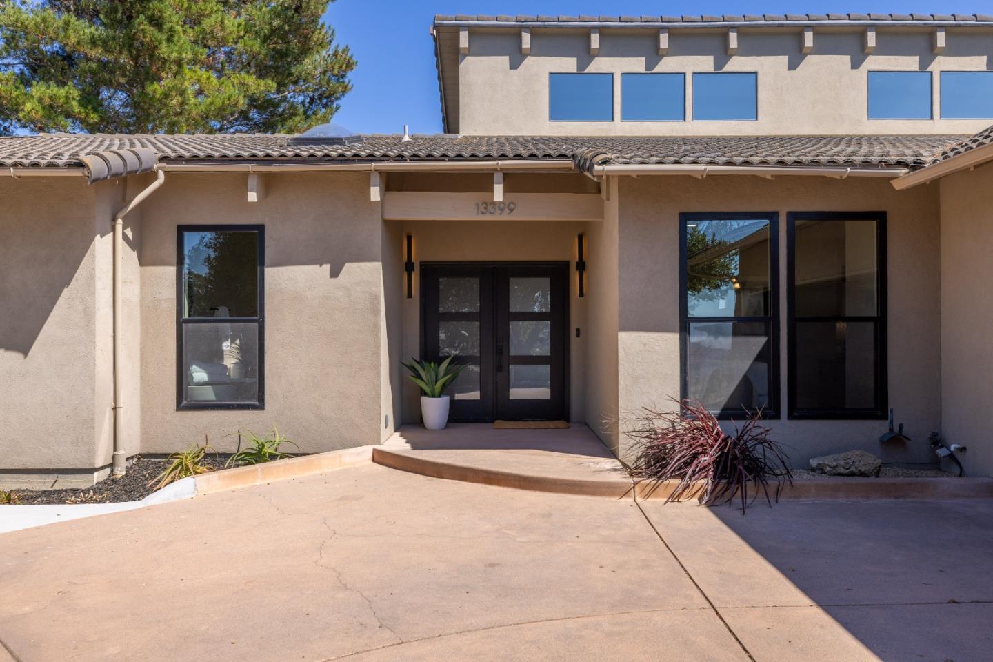 13399 Middle Canyon Road Carmel Valley, CA 93924 - Photo 3 of 32 a front view of a building with a outdoor space