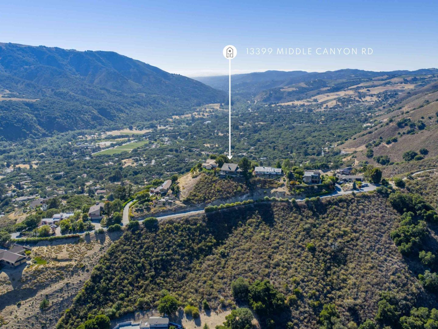 13399 Middle Canyon Road Carmel Valley, CA 93924 - Photo 31 of 32 a view of a city with mountains in the background