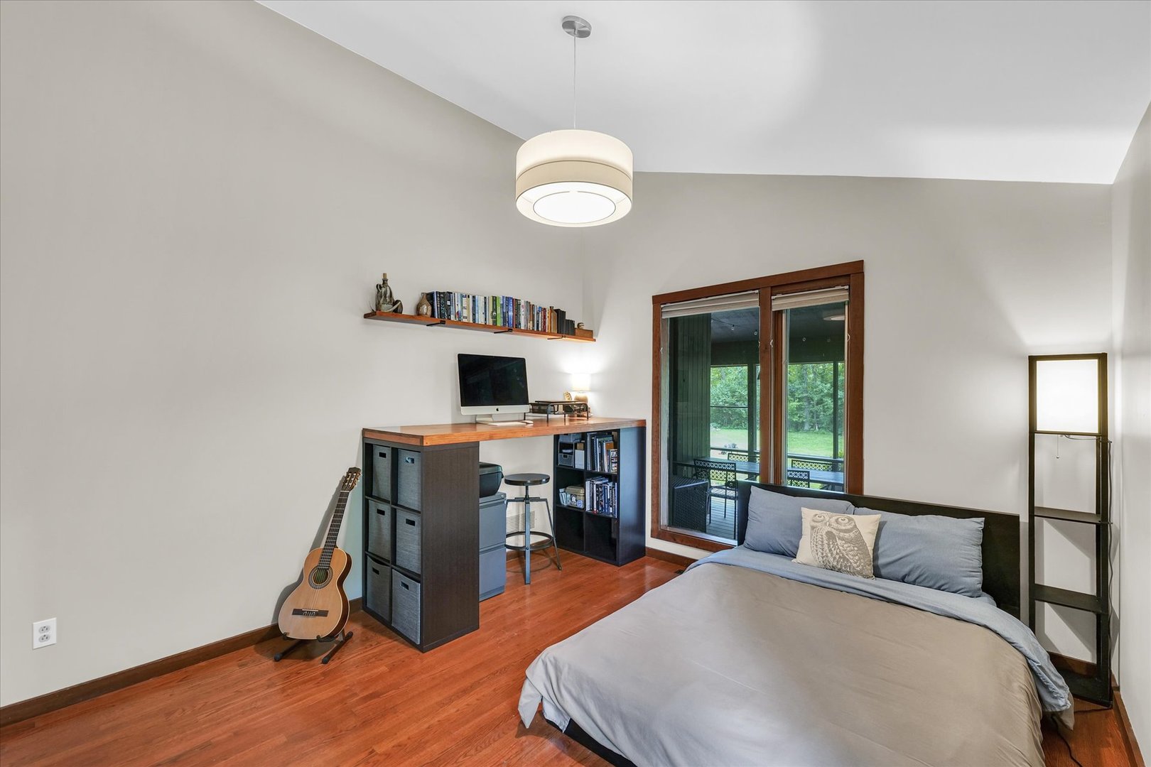 1910 Stratford Court Champaign, IL 61821 - Photo 20 of 39 a bedroom with a bed and a flat tv screen on the dresser