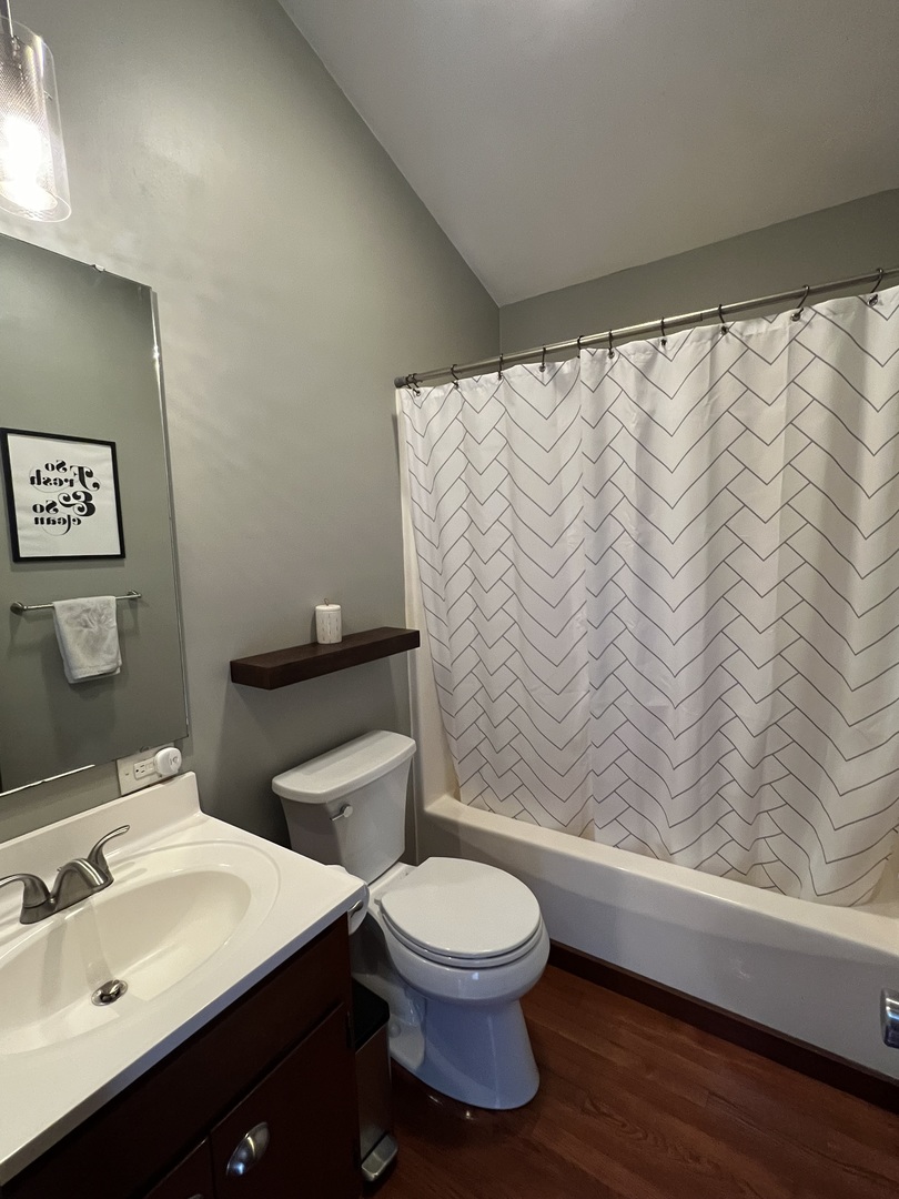 1910 Stratford Court Champaign, IL 61821 - Photo 22 of 39 a bathroom with a sink a toilet and a mirror