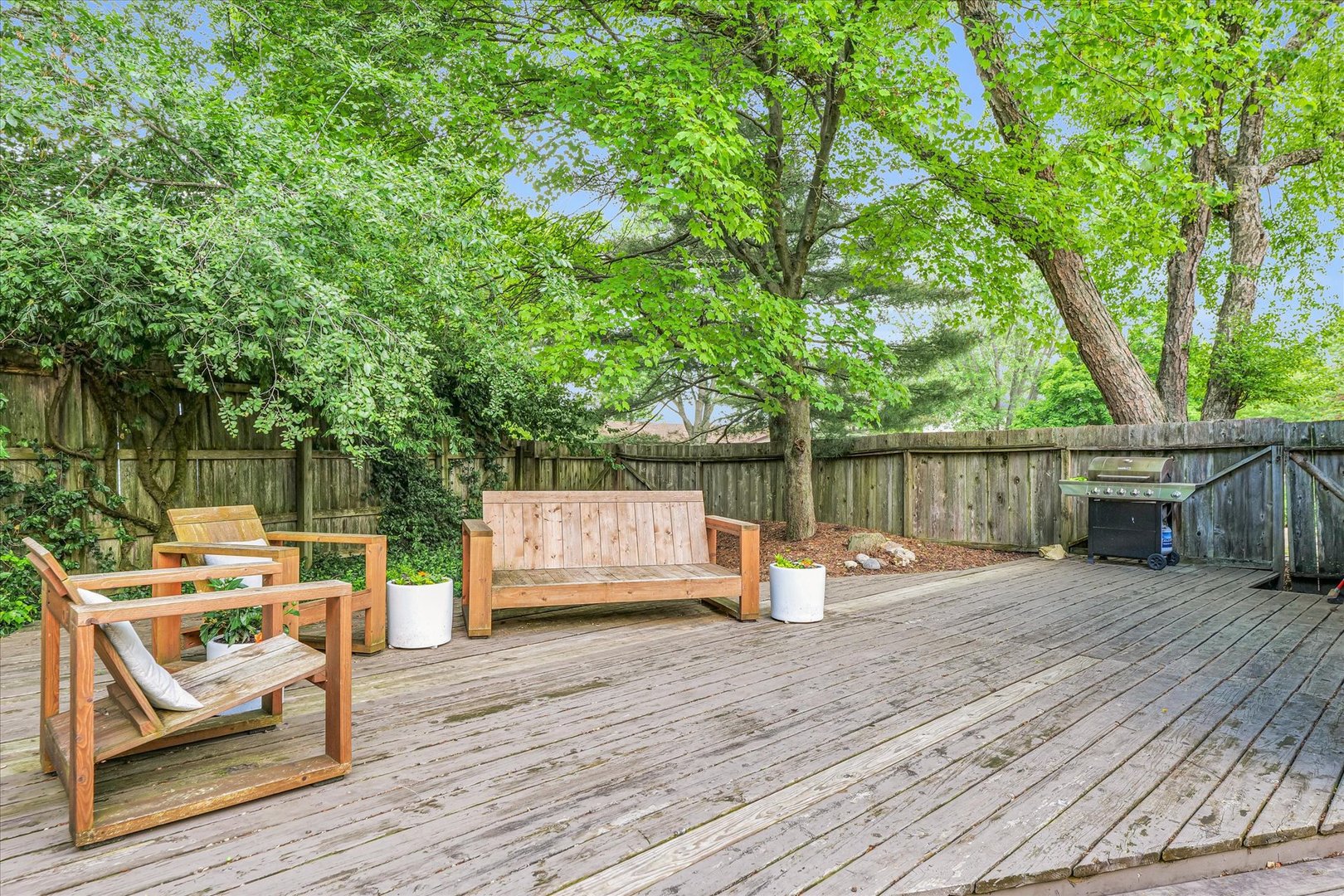 1910 Stratford Court Champaign, IL 61821 - Photo 35 of 39 a deck view with a table and chairs in the patio