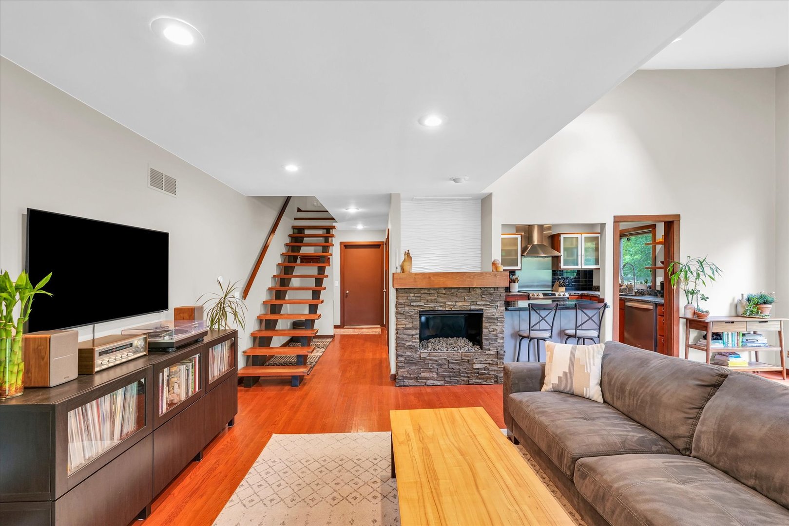 1910 Stratford Court Champaign, IL 61821 - Photo 7 of 39 a living room with furniture and a flat screen tv