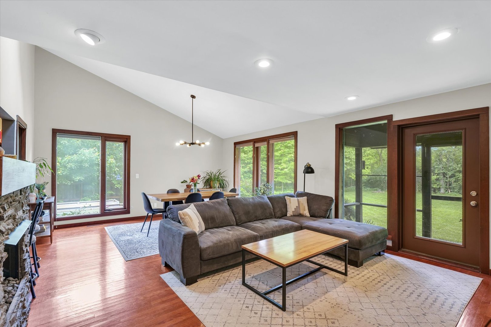 1910 Stratford Court Champaign, IL 61821 - Photo 9 of 39 a living room with furniture and a flat screen tv
