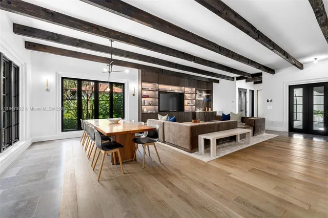 a outdoor space with a large window and furniture