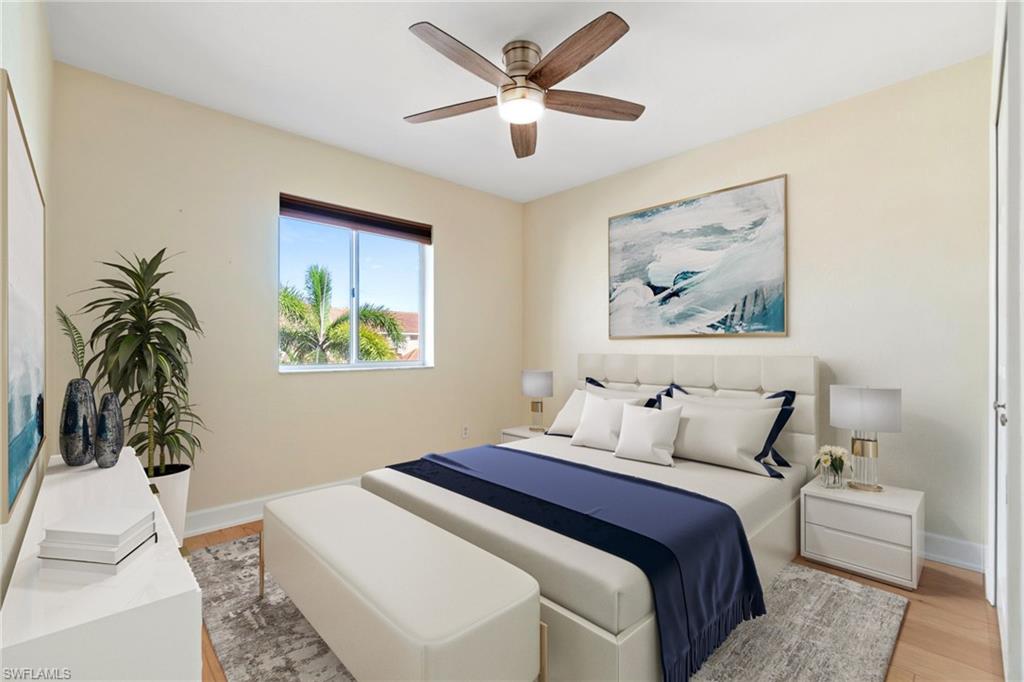17560 Cherry Ridge Lane Fort Myers, FL 33967 - Photo 23 of 30 a bedroom with a bed and a painting on the wall