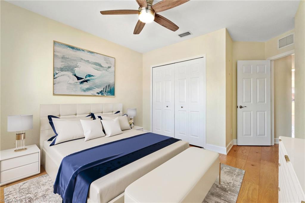 17560 Cherry Ridge Lane Fort Myers, FL 33967 - Photo 24 of 30 a bedroom with a bed and a painting on the wall
