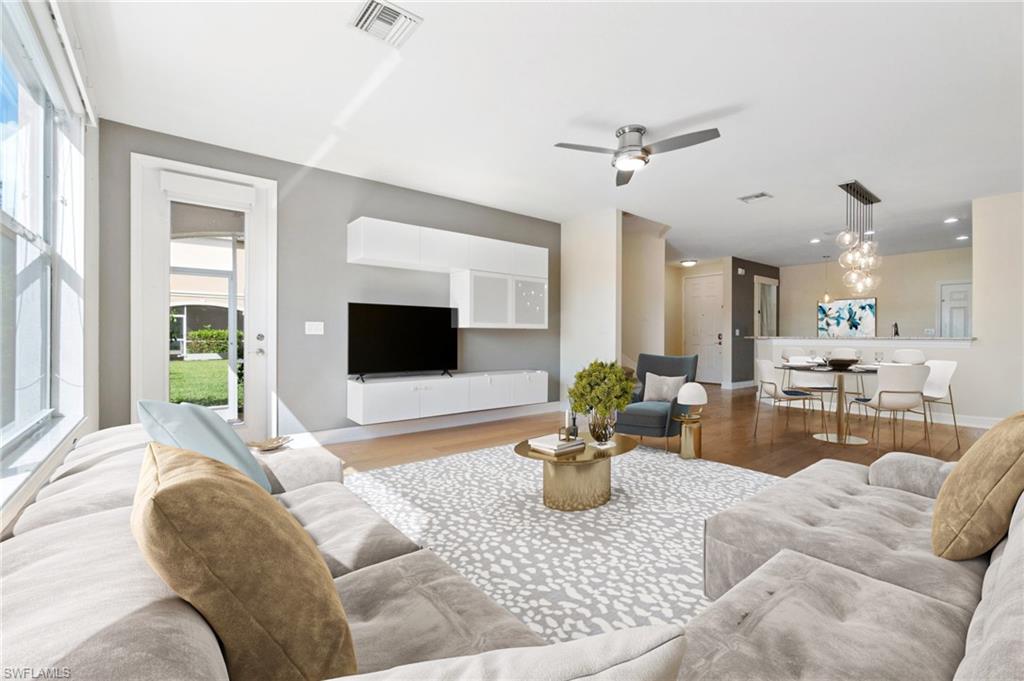 17560 Cherry Ridge Lane Fort Myers, FL 33967 - Photo 9 of 30 a living room with furniture and a flat screen tv