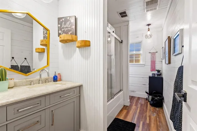 a bathroom with a sink and a mirror