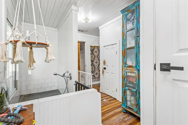 a bathroom with a bathtub and shower