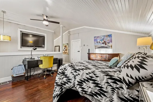 a view of a livingroom with workspace and a couch