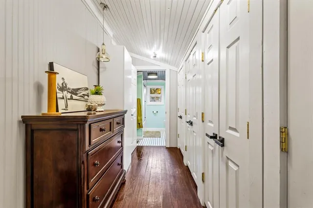 a view of an entryway with wooden floor