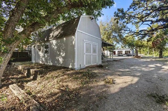 a view of a yard with large tree