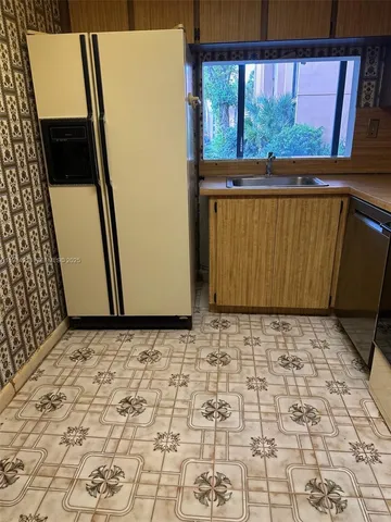 a view of a door with wooden floor