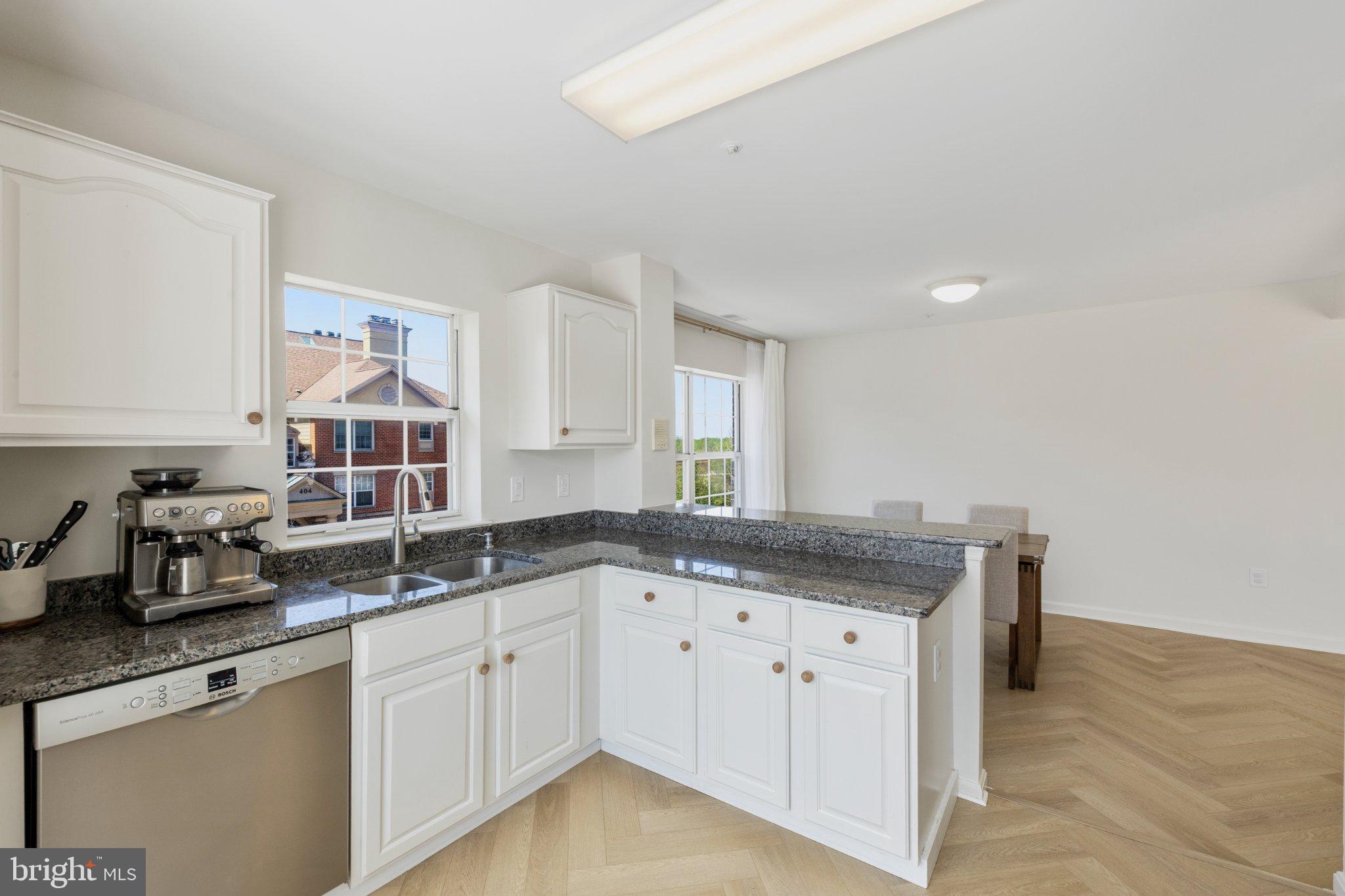 408 Ridgepoint Place, Unit 40838 Gaithersburg, MD 20878 - Photo 11 of 28 Bright and airy modern kitchen space.