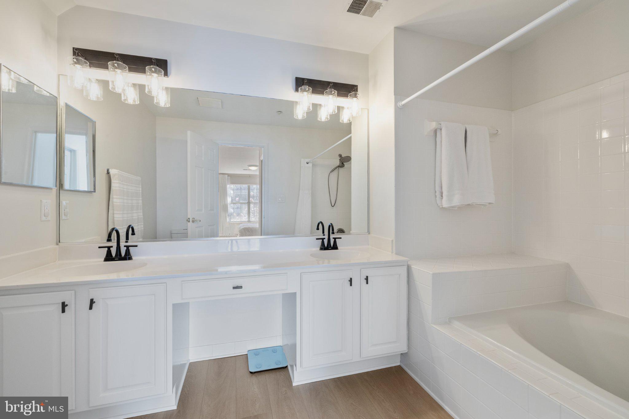 408 Ridgepoint Place, Unit 40838 Gaithersburg, MD 20878 - Photo 19 of 28 Sleek modern bathroom with elegance.