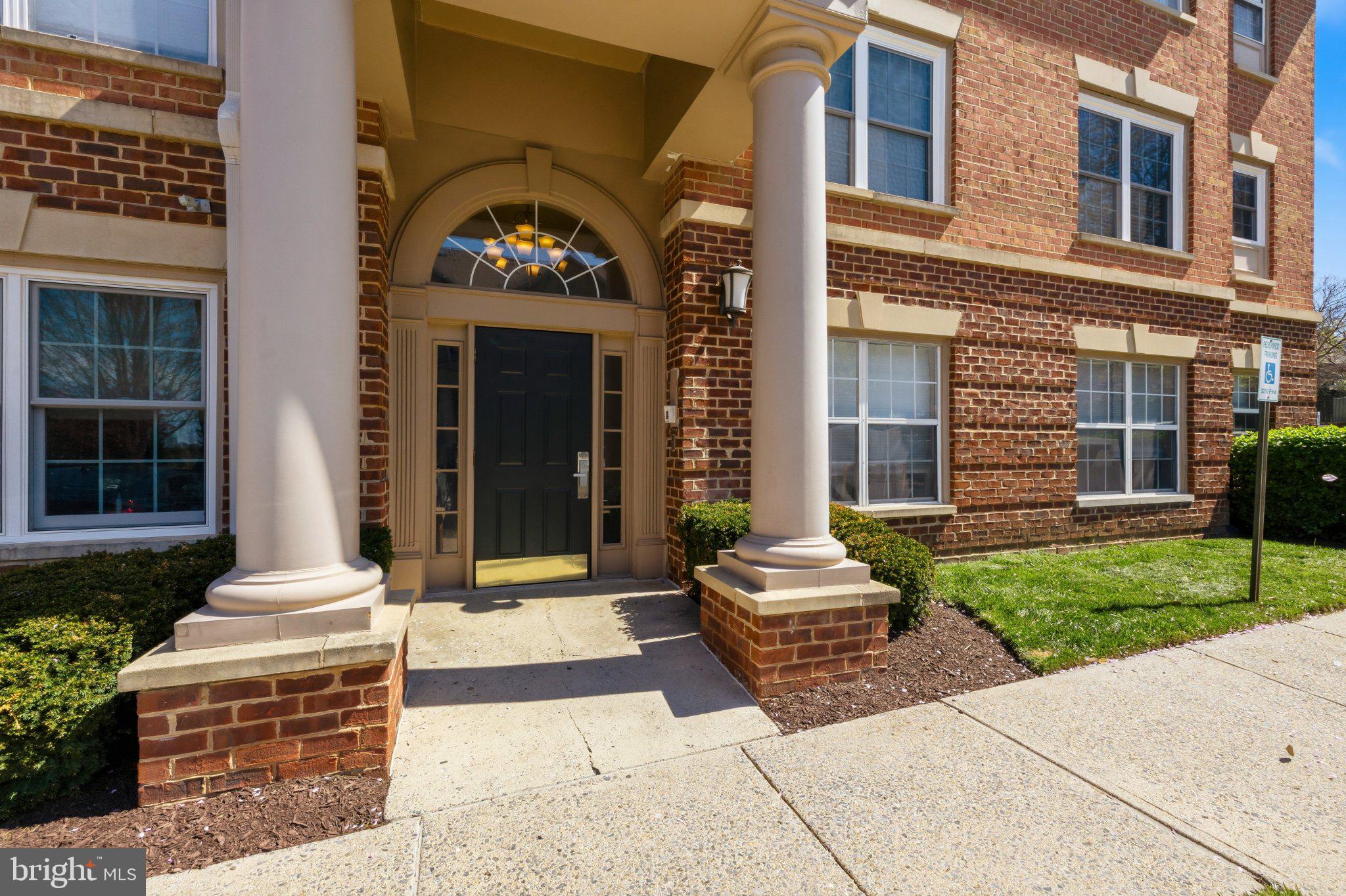 408 Ridgepoint Place, Unit 40838 Gaithersburg, MD 20878 - Photo 2 of 28 Charming entrance to a brick residence.