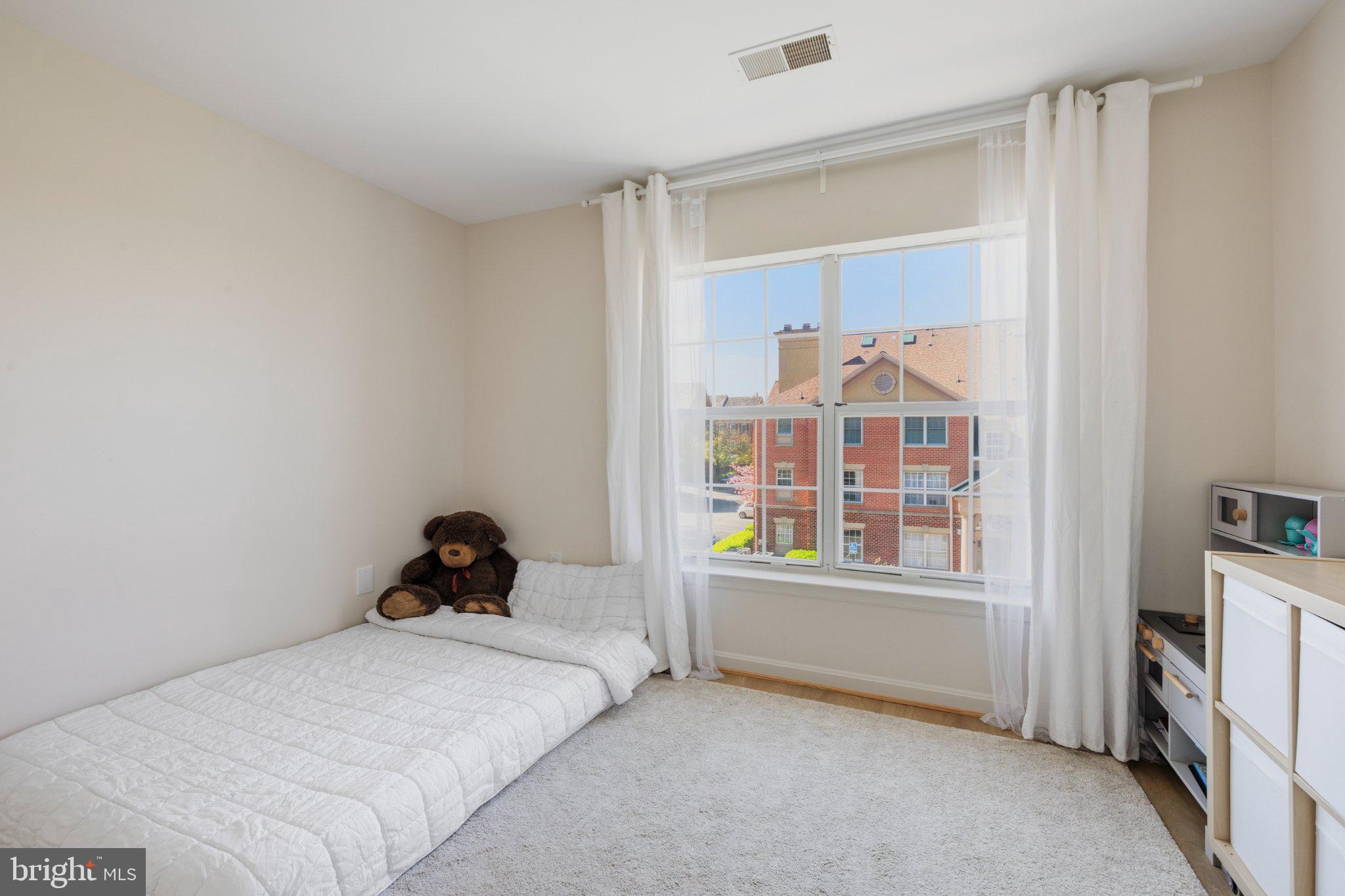 408 Ridgepoint Place, Unit 40838 Gaithersburg, MD 20878 - Photo 22 of 28 Bright and airy bedroom retreat.