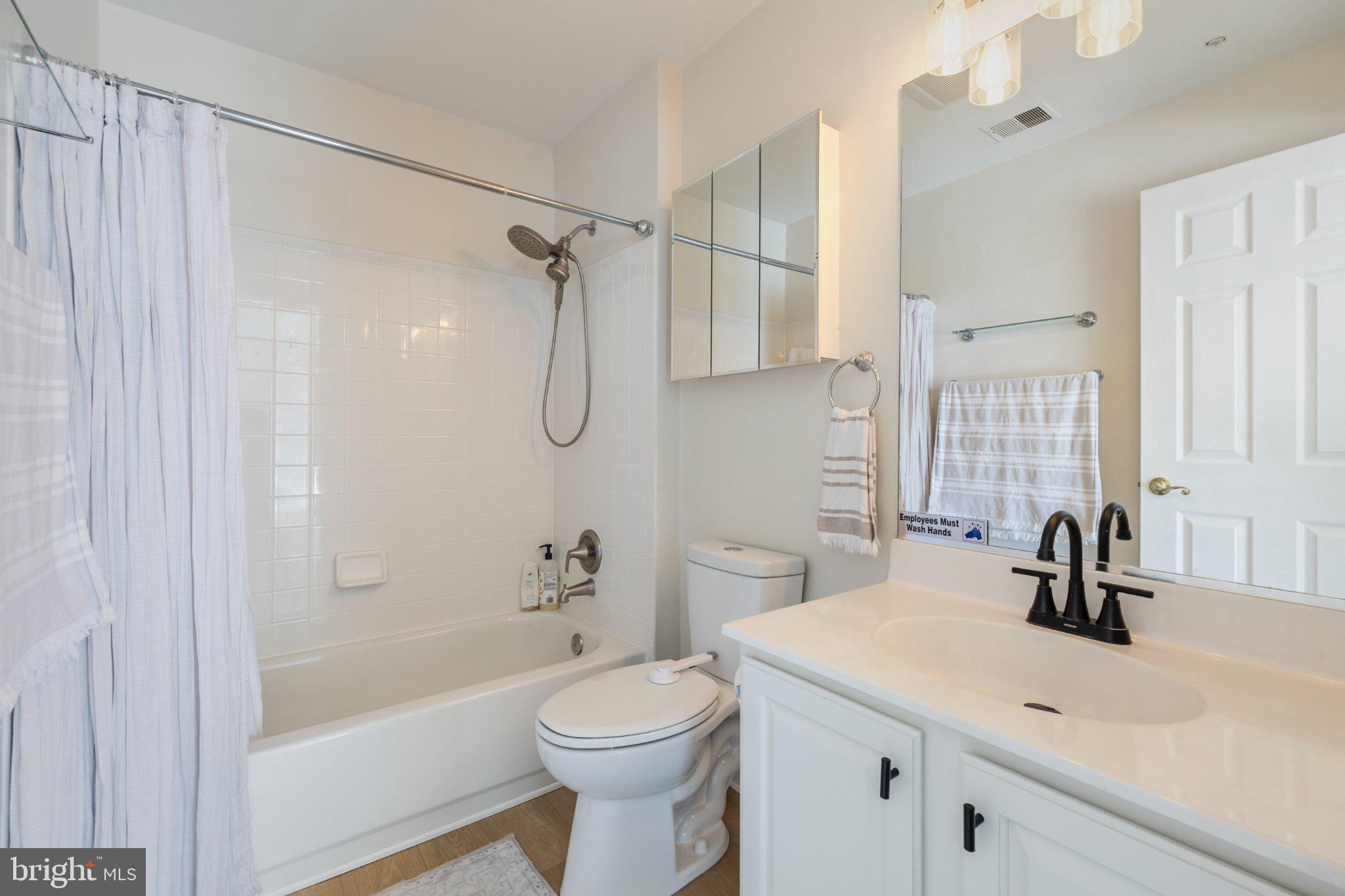 408 Ridgepoint Place, Unit 40838 Gaithersburg, MD 20878 - Photo 24 of 28 Modern bathroom with sleek finishes.