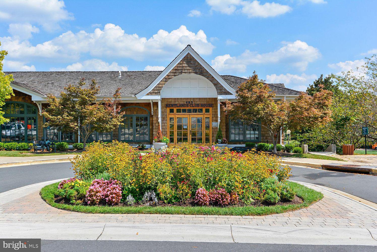 408 Ridgepoint Place, Unit 40838 Gaithersburg, MD 20878 - Photo 29 of 38 a front view of a house with a yard