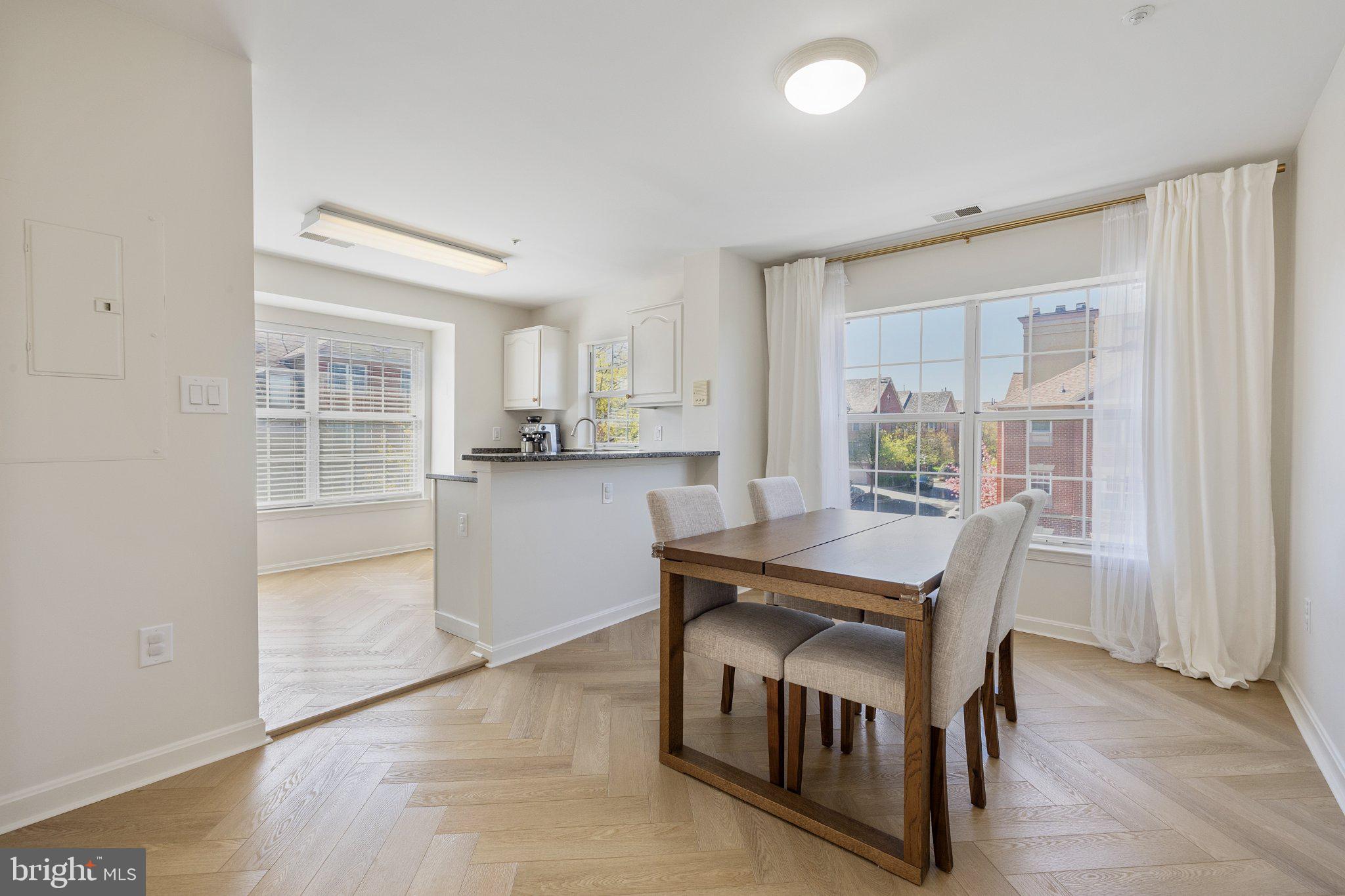 408 Ridgepoint Place, Unit 40838 Gaithersburg, MD 20878 - Photo 7 of 28 Bright and airy dining space awaits.