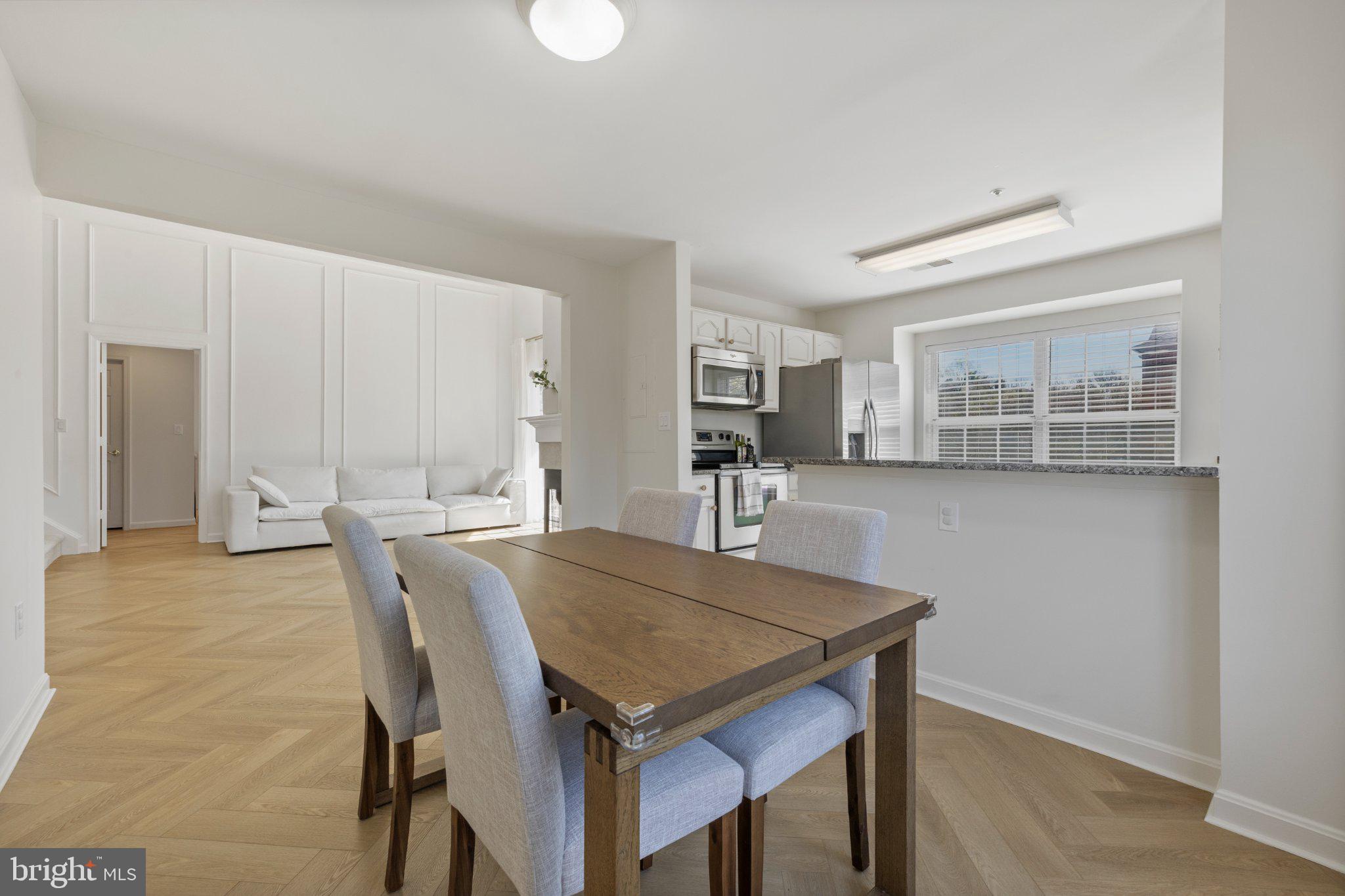 408 Ridgepoint Place, Unit 40838 Gaithersburg, MD 20878 - Photo 9 of 28 Bright and airy dining space awaits.
