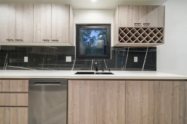 a closeup of a sink and cabinets