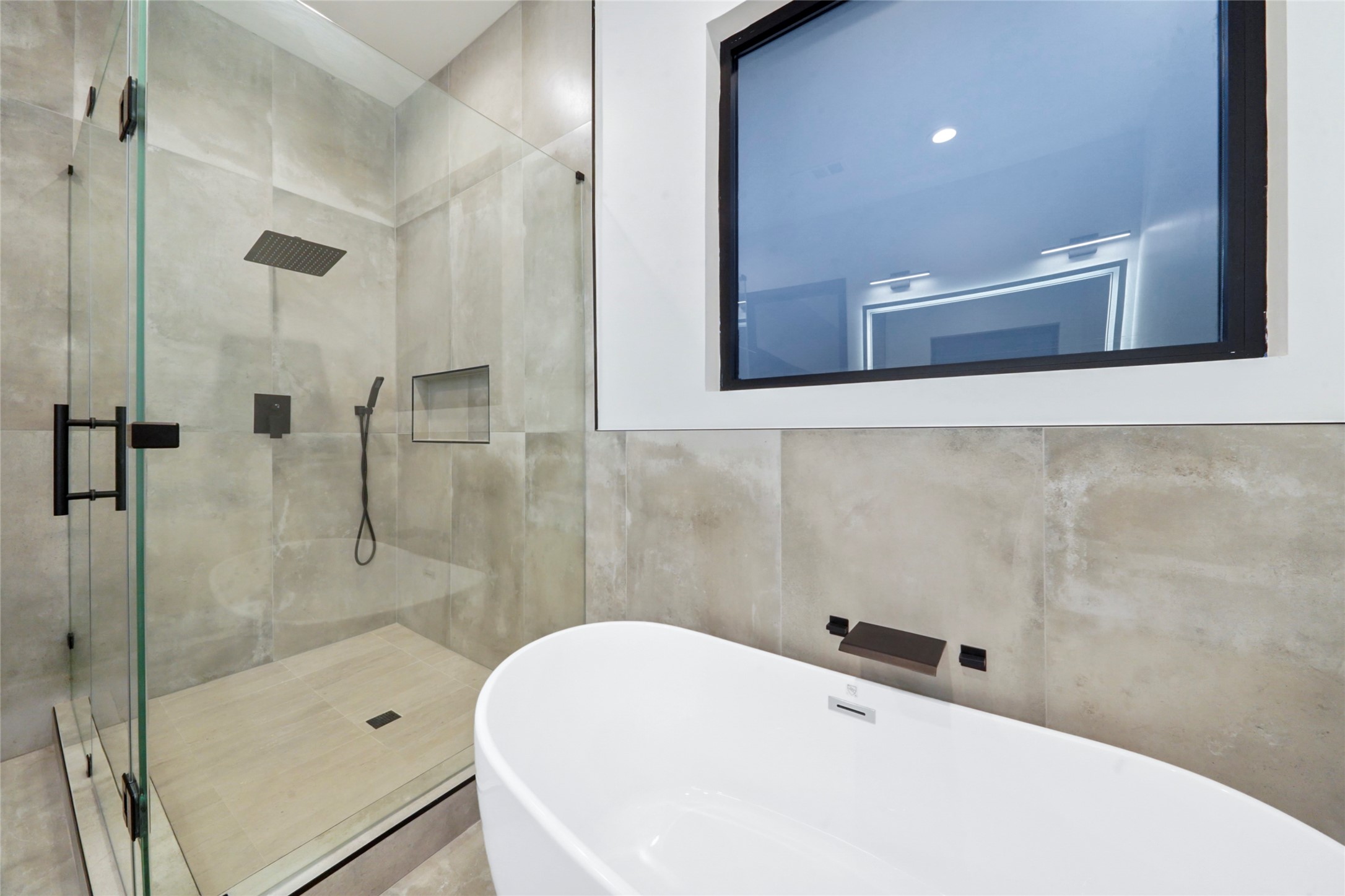 2438 Carriage Lamp Lane Conroe, TX 77384 - Photo 23 of 41 a bathroom with a bathtub and a shower