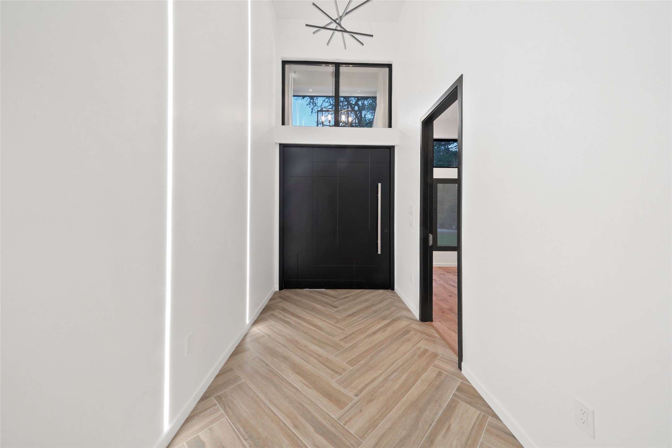 2438 Carriage Lamp Lane Conroe, TX 77384 - Photo 3 of 41 a view of a hallway to rooms and stairs