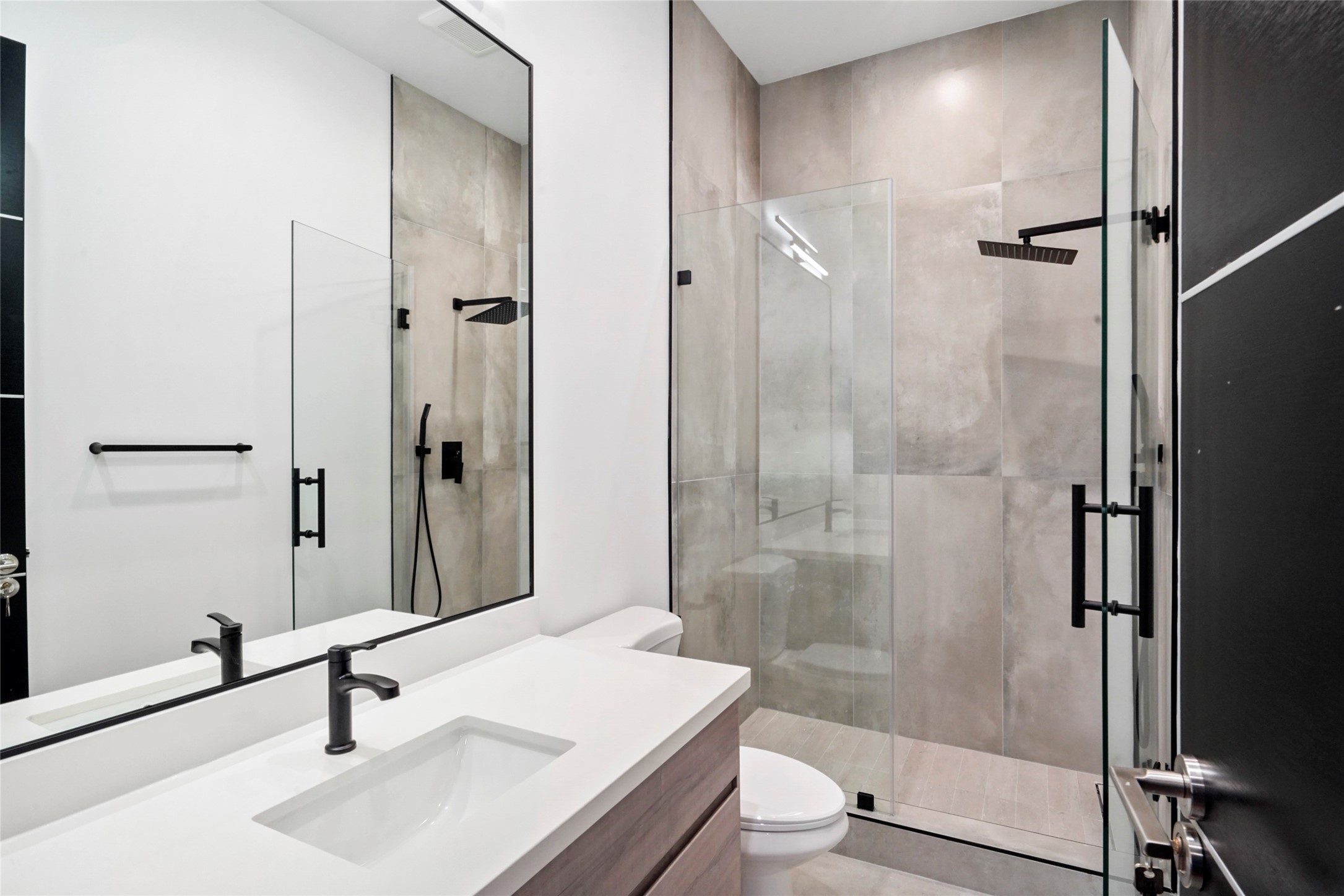 2438 Carriage Lamp Lane Conroe, TX 77384 - Photo 33 of 41 a bathroom with a sink toilet and shower