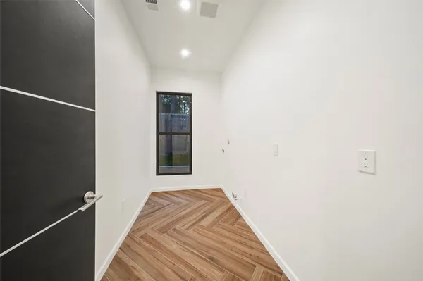 a view of a livingroom with a ceiling fan and kitchen view