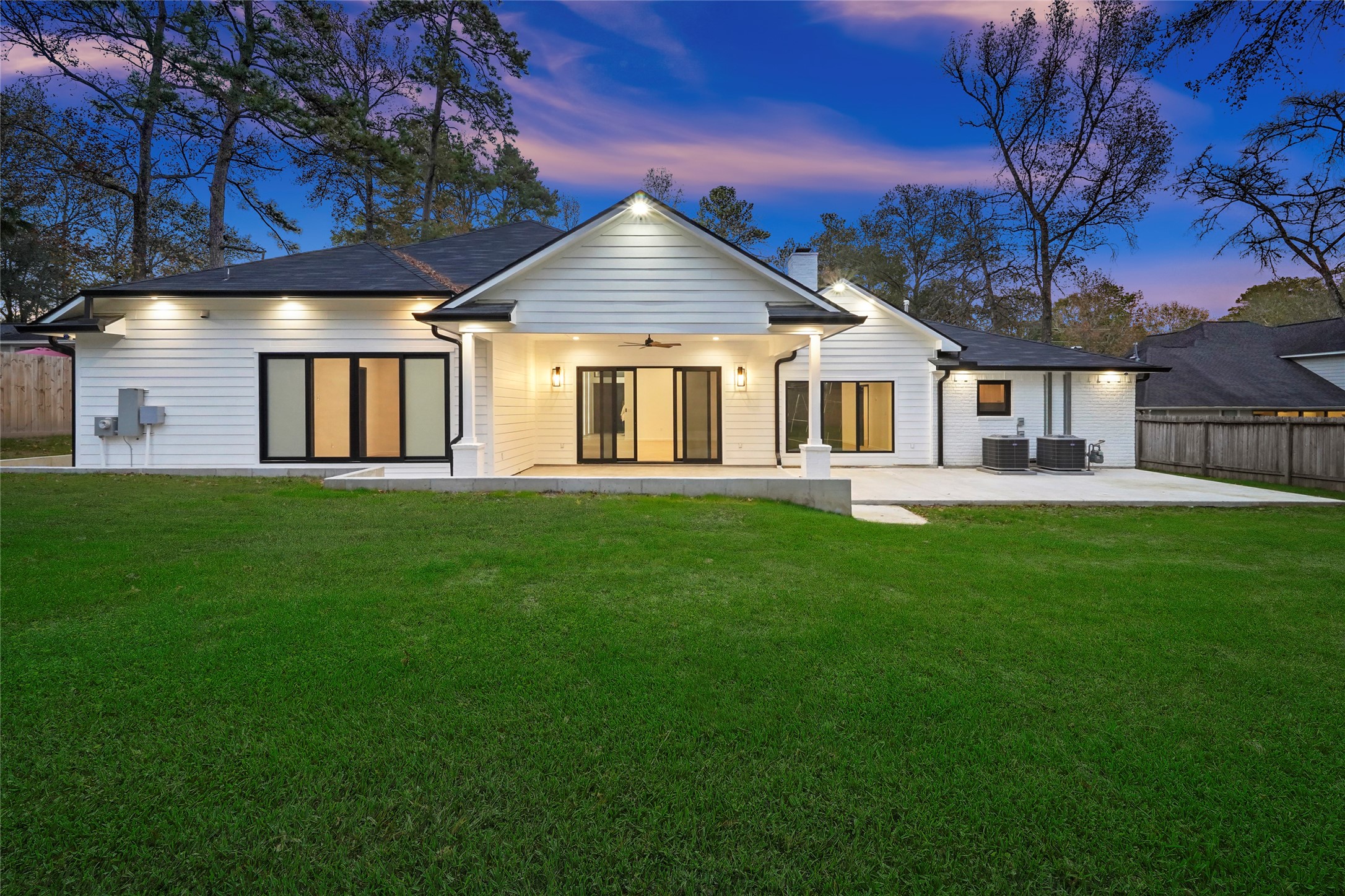 2438 Carriage Lamp Lane Conroe, TX 77384 - Photo 36 of 41 a front view of a house with a yard