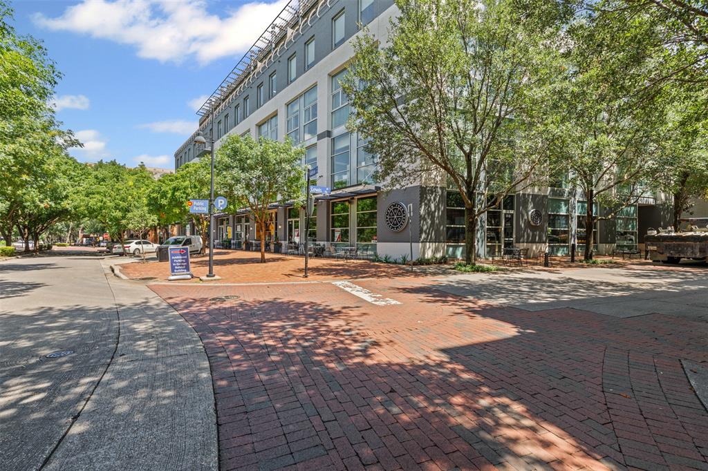 15759 Seabolt Place, Unit 44 Addison, TX 75001 - Photo 39 of 40 a view of a building with trees