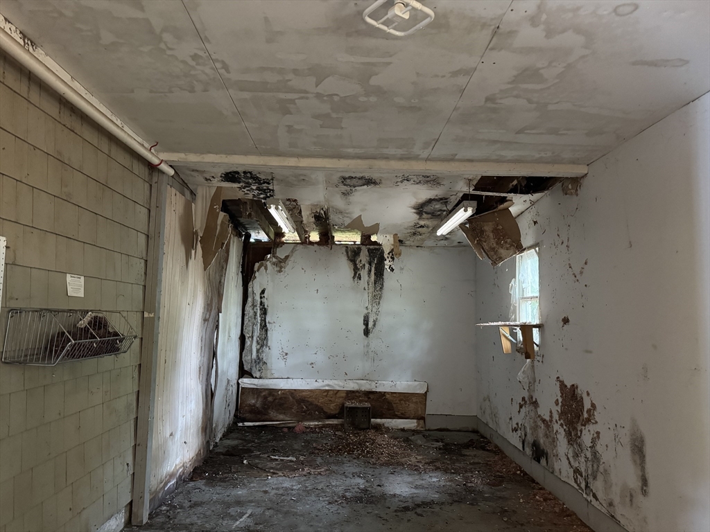 9 Edgewood Avenue Merrimack, NH 03054 - Photo 13 of 13 a view of a room with rack on the wall