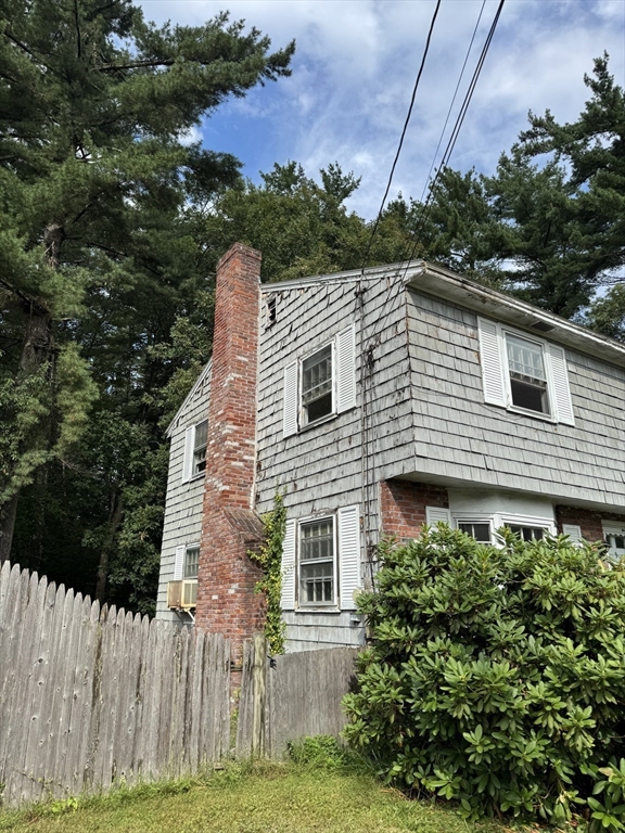 9 Edgewood Avenue Merrimack, NH 03054 - Photo 3 of 13 a view of a house with a yard