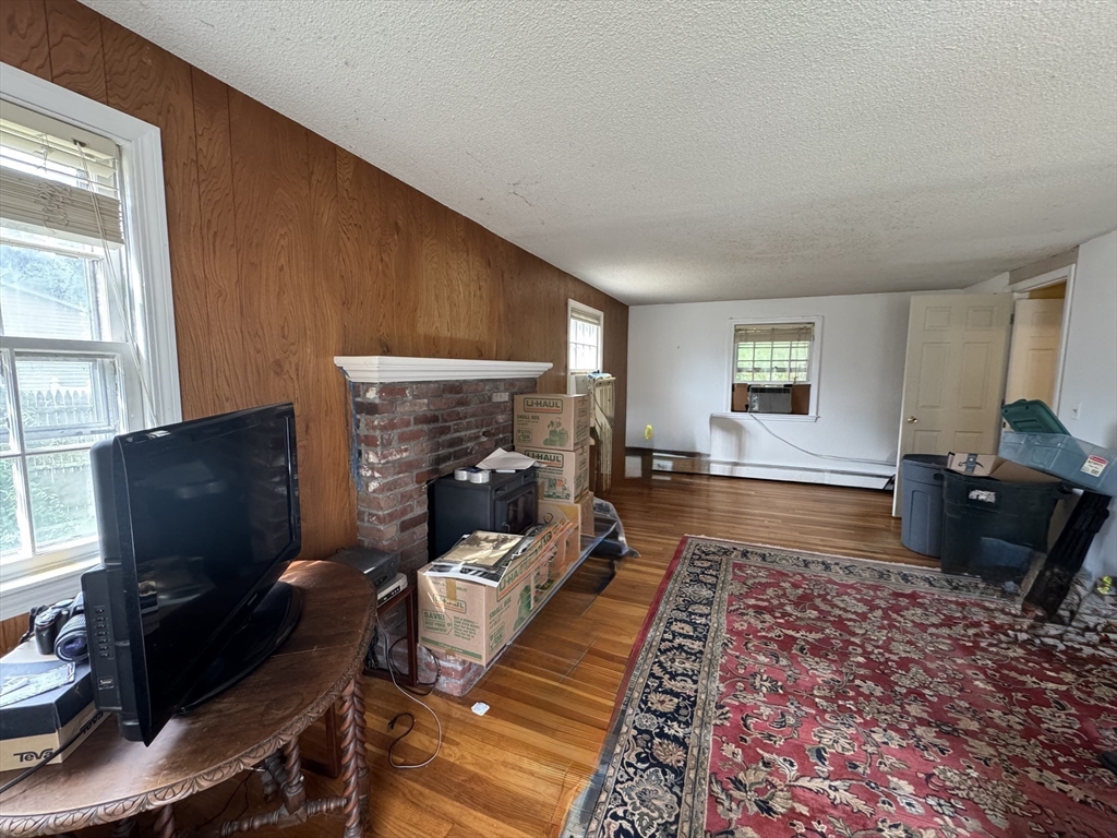 9 Edgewood Avenue Merrimack, NH 03054 - Photo 5 of 13 a living room with furniture rug and a window