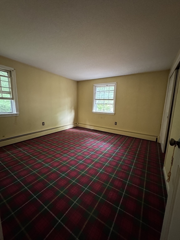 9 Edgewood Avenue Merrimack, NH 03054 - Photo 8 of 13 a view of an empty room with a window