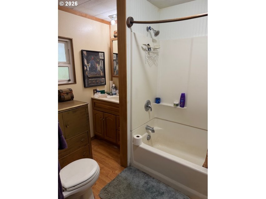 64294 Penny Road Coos Bay, OR 97420 - Photo 20 of 26 a bathroom with a sink a toilet and a bathtub