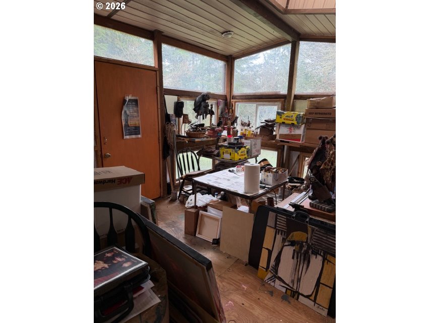 64294 Penny Road Coos Bay, OR 97420 - Photo 22 of 26 a view of a dining room with furniture and a window