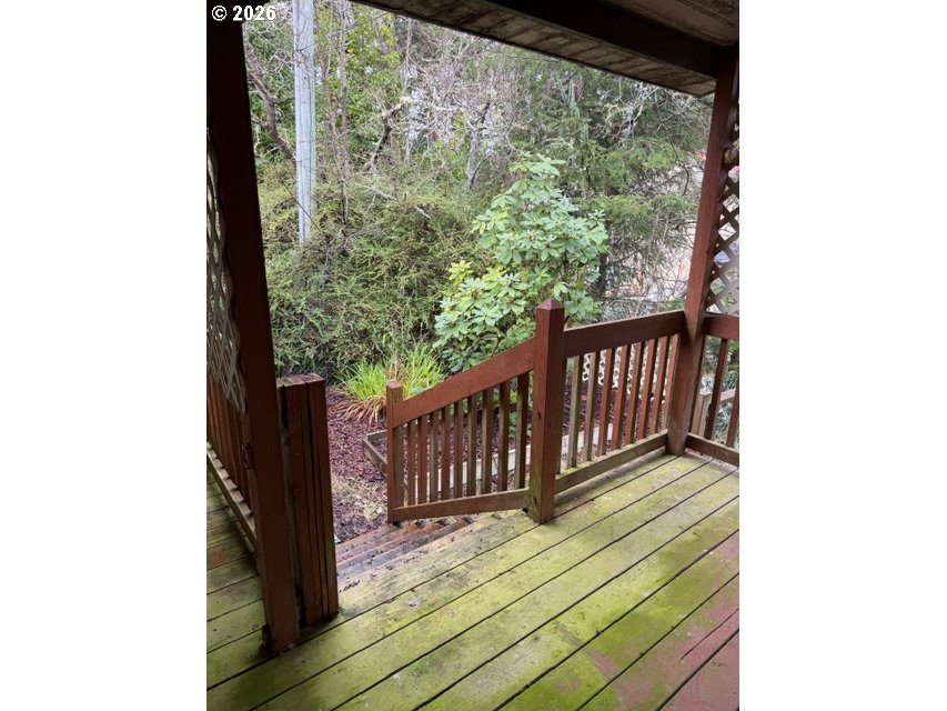 64294 Penny Road Coos Bay, OR 97420 - Photo 24 of 26 a view of a balcony with wooden floor
