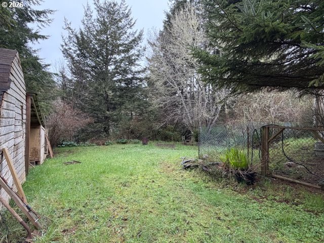 64294 Penny Road Coos Bay, OR 97420 - Photo 25 of 26 a backyard of a house with lots of green space